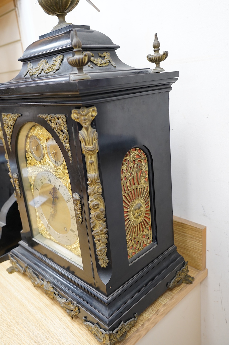 A large Edwardian ebonised mahogany and ormolu mounted bracket clock and bracket, movement by W&H Sch., striking on two coiled gongs, dial signed J. Lewis, Margate and Ramsgate, 71cm high. Condition fair to good, the clo